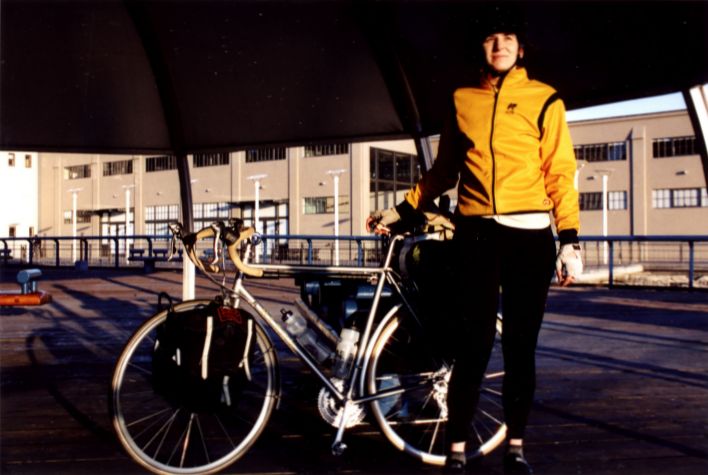 amy_and_bike_at_ferry_terminal.jpg